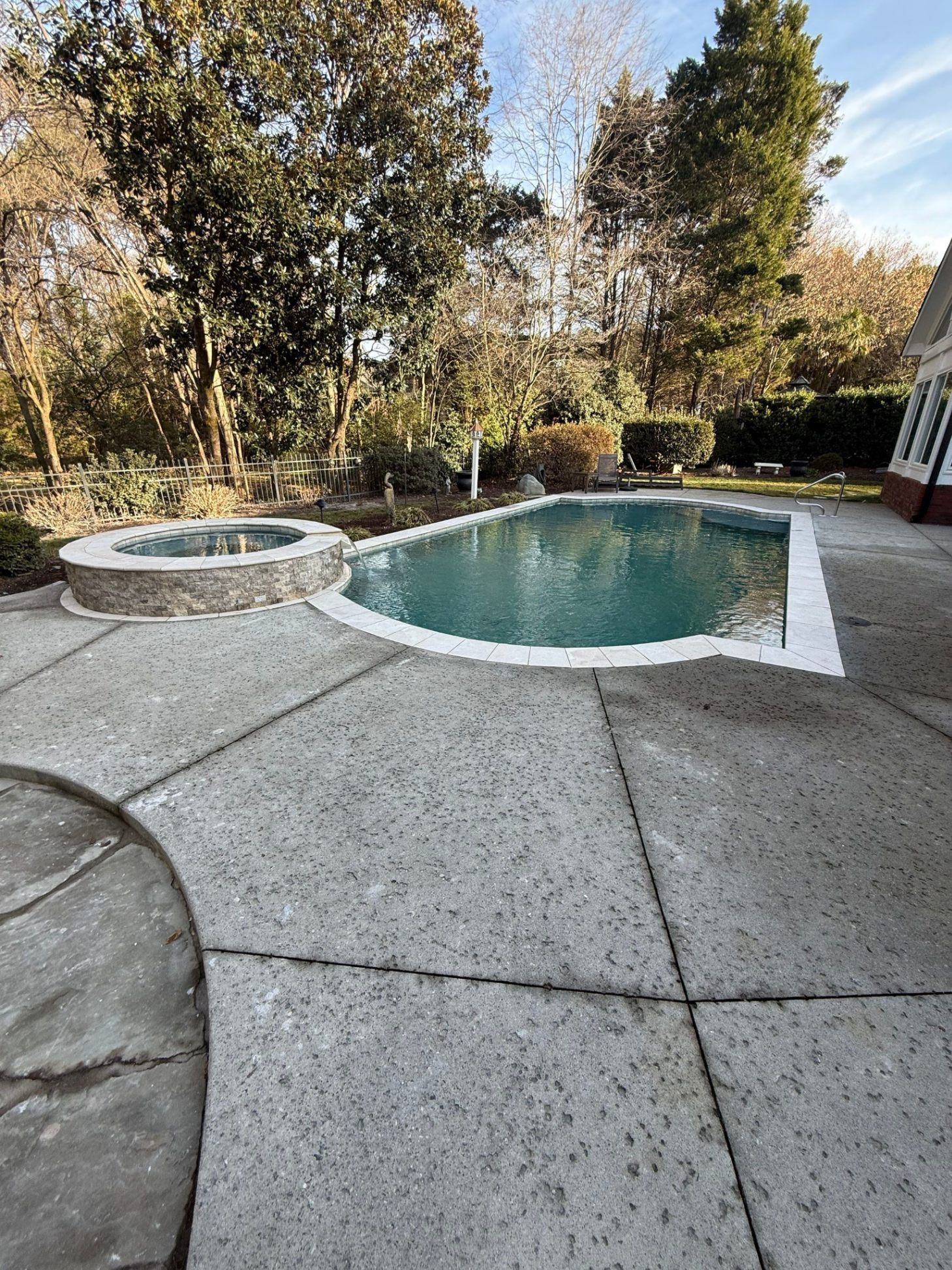 Custom pool with raised spa and tile work